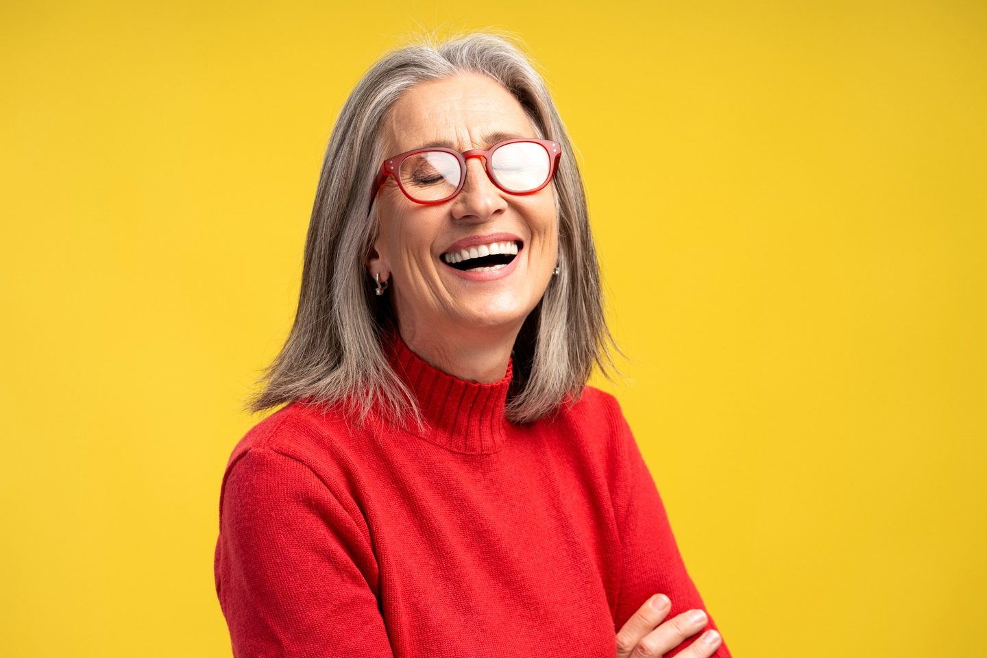 Experienced professional smiling against a bright background